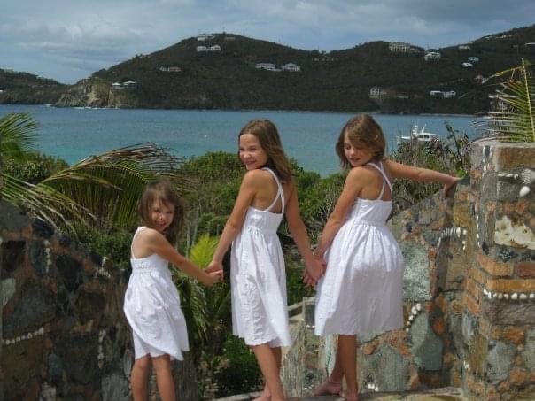 3 girls in white dresses overlooking the bay
